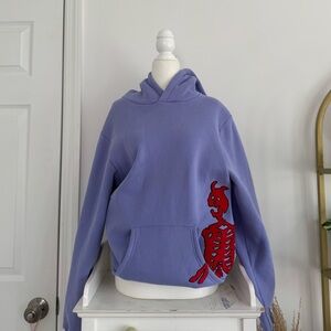 Purple Hoodie with Red Skeleton Design